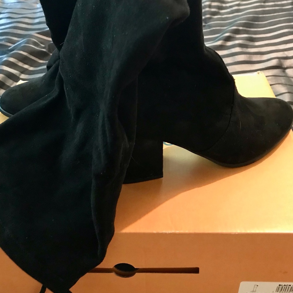 Woman’s Unisa Hi Black Fabric sexy boots.